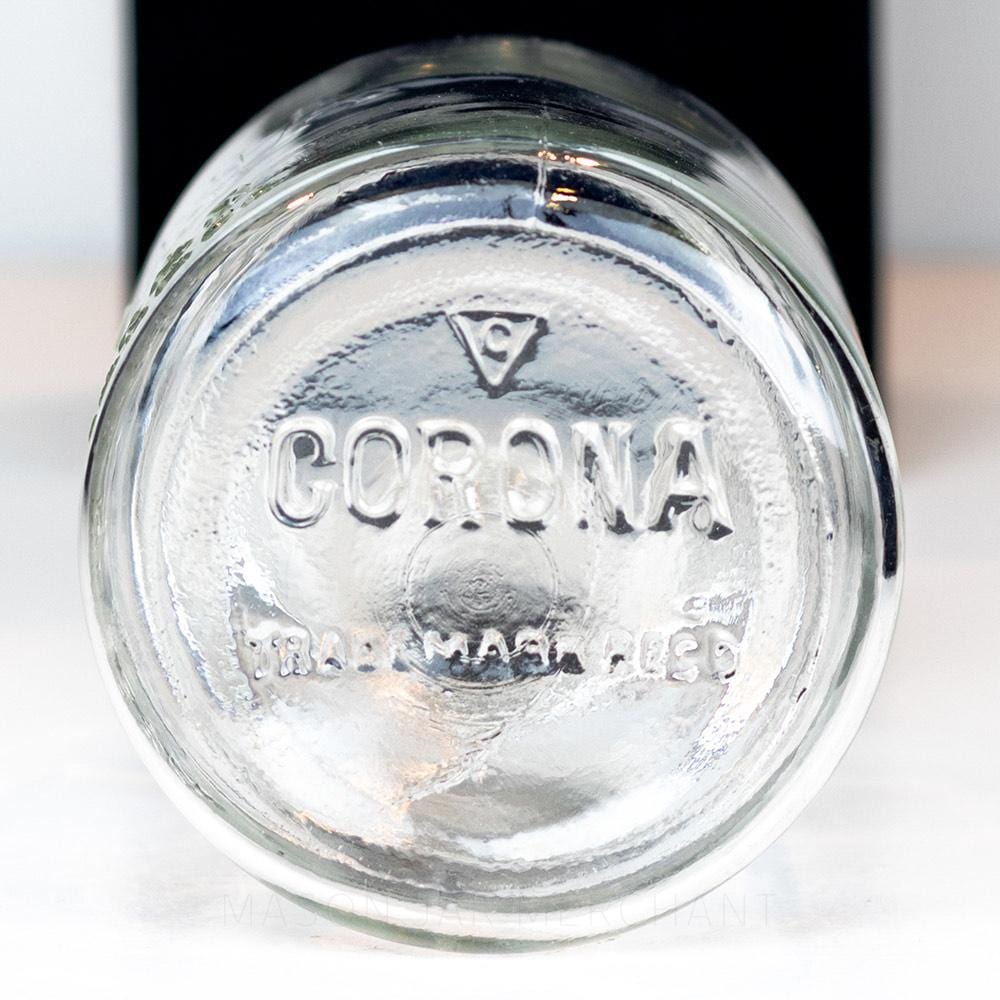 Vintage gem mouth quart mason jar with Improved Corona Jar logo, on a white background
