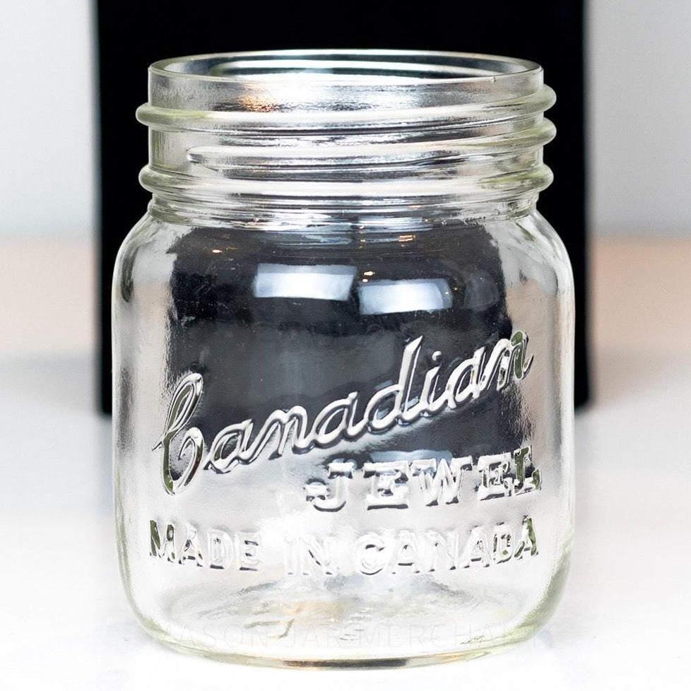 Adorable gem mouth 13 oz mason jar with Canadian Jewel logo, on a white background