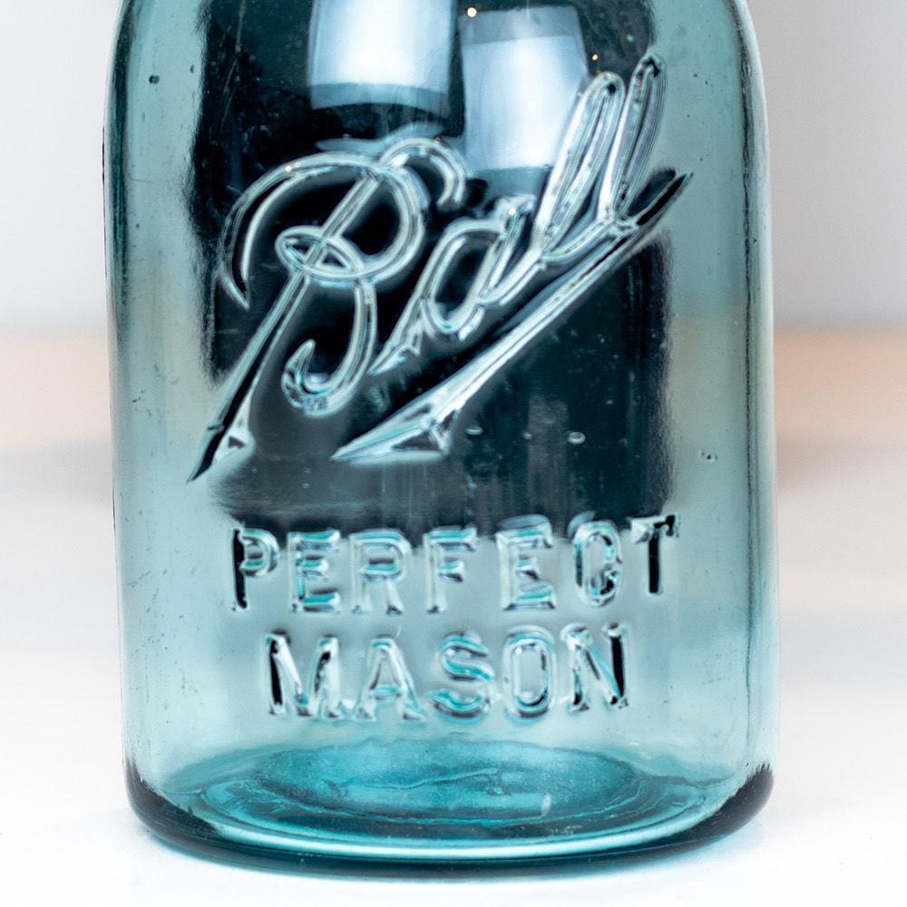 Vintage blue Ball Perfect Mason regular mouth quart jar on a white background