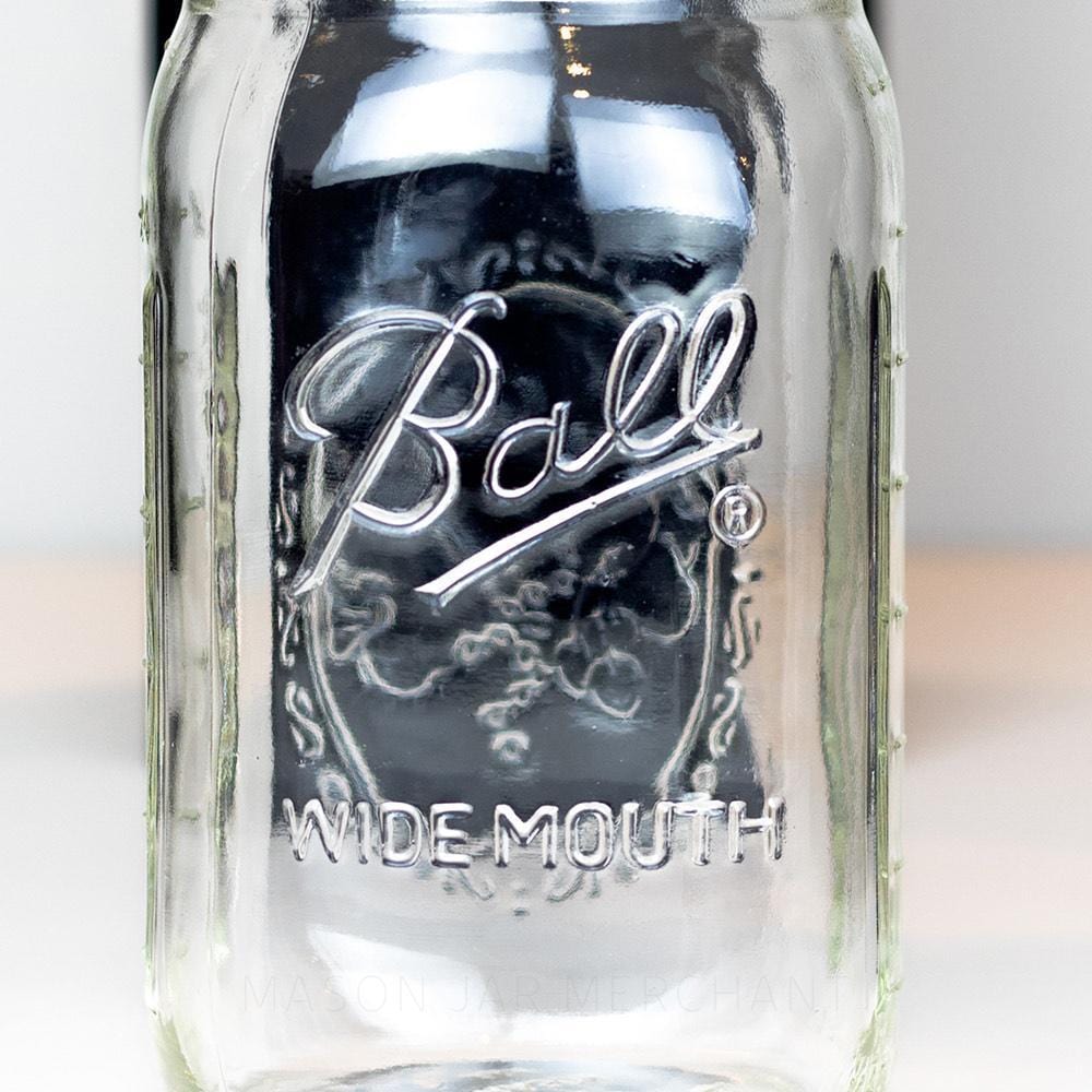 Wide mouth quart mason jar with Ball logo on a white background