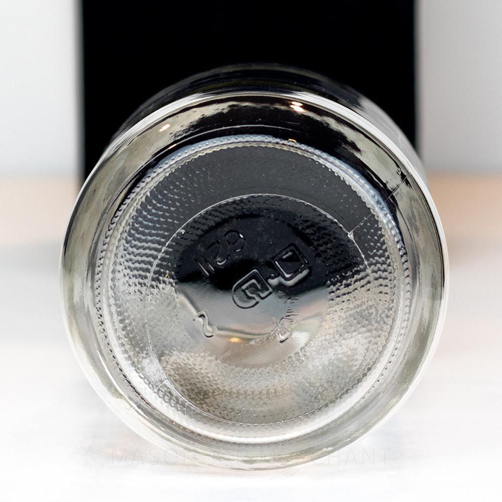 Wide mouth quart mason jar with plain sides and no logo on a white background