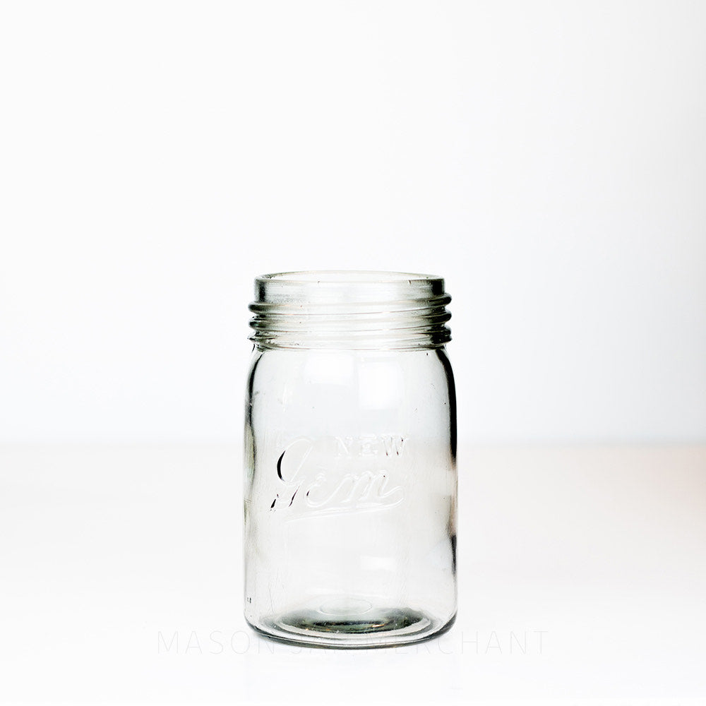 Vintage gem mouth pint mason jar with New Gem logo against a white background