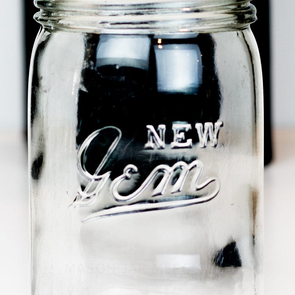 Vintage gem mouth pint mason jar with New Gem logo against a white background