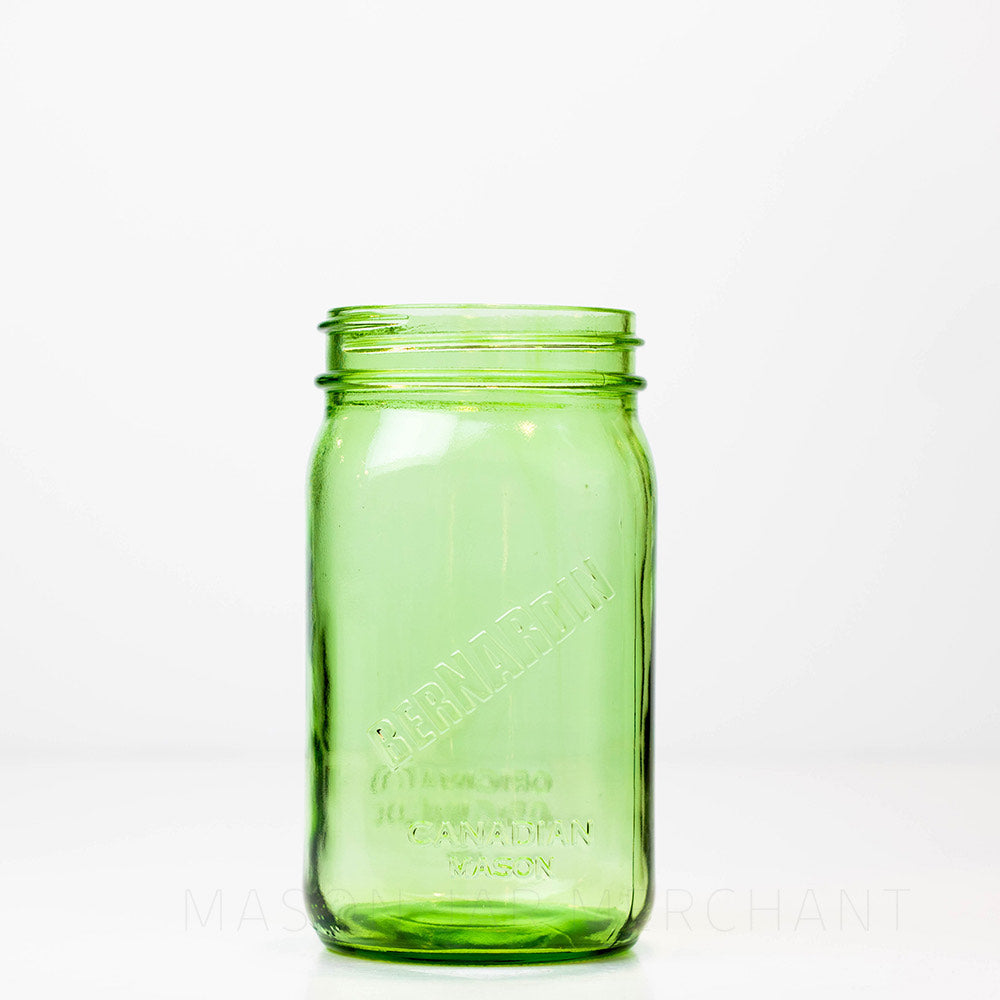 Green Bernardin wide mouth quart mason jar against a white background