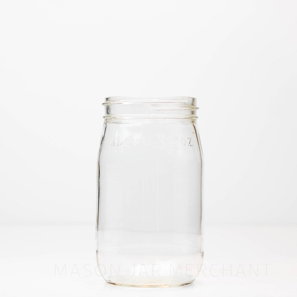 Dominion wide mouth quart mason jar with Fl. 32 oz printed at the top, against a white background