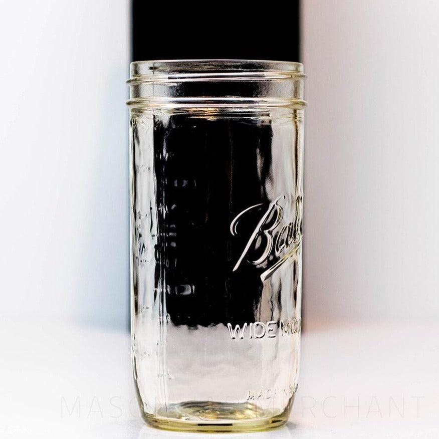 side of a 24 oz wide mouth Ball mason jar against a white background