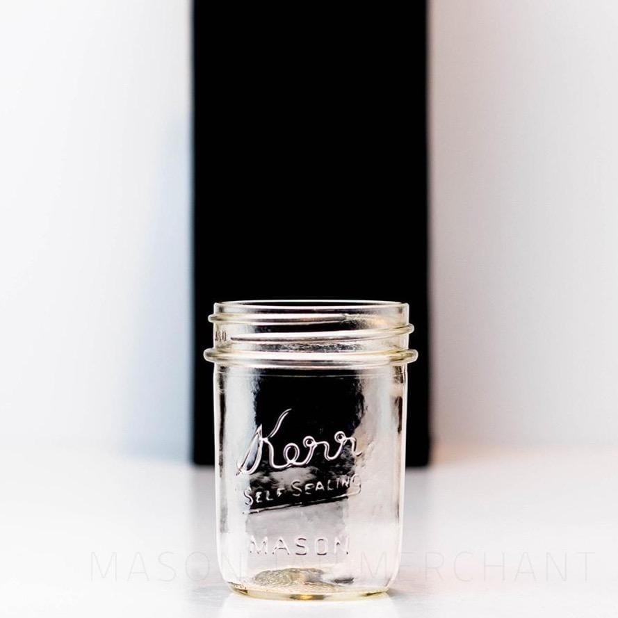 regular mouth half pint mason jar with a Kerr logo on the front against a white background