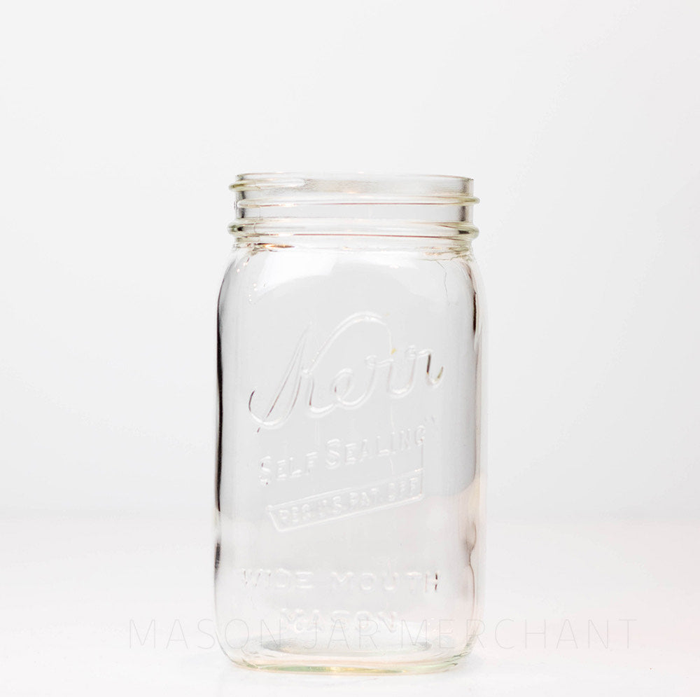 mason jar - says "Kerr" on a upwards slant, "self sealing" beneath, "reg. u.s. pat off" below in a rectangle, "WIDE MOUTH MASON" just above base