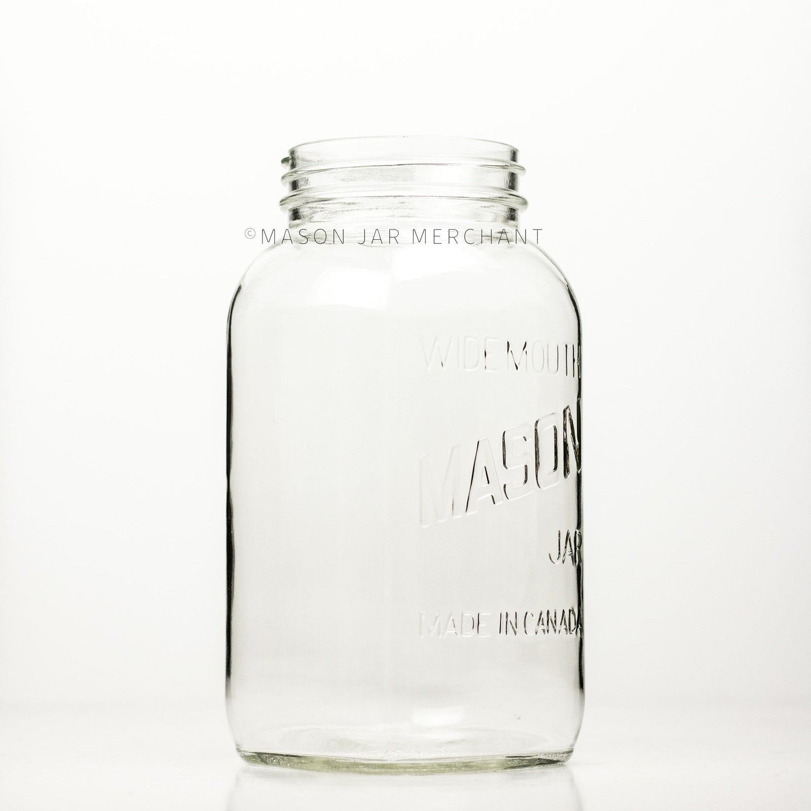 Wide mouth half-gallon mason jar with Mason logo, against a white background
