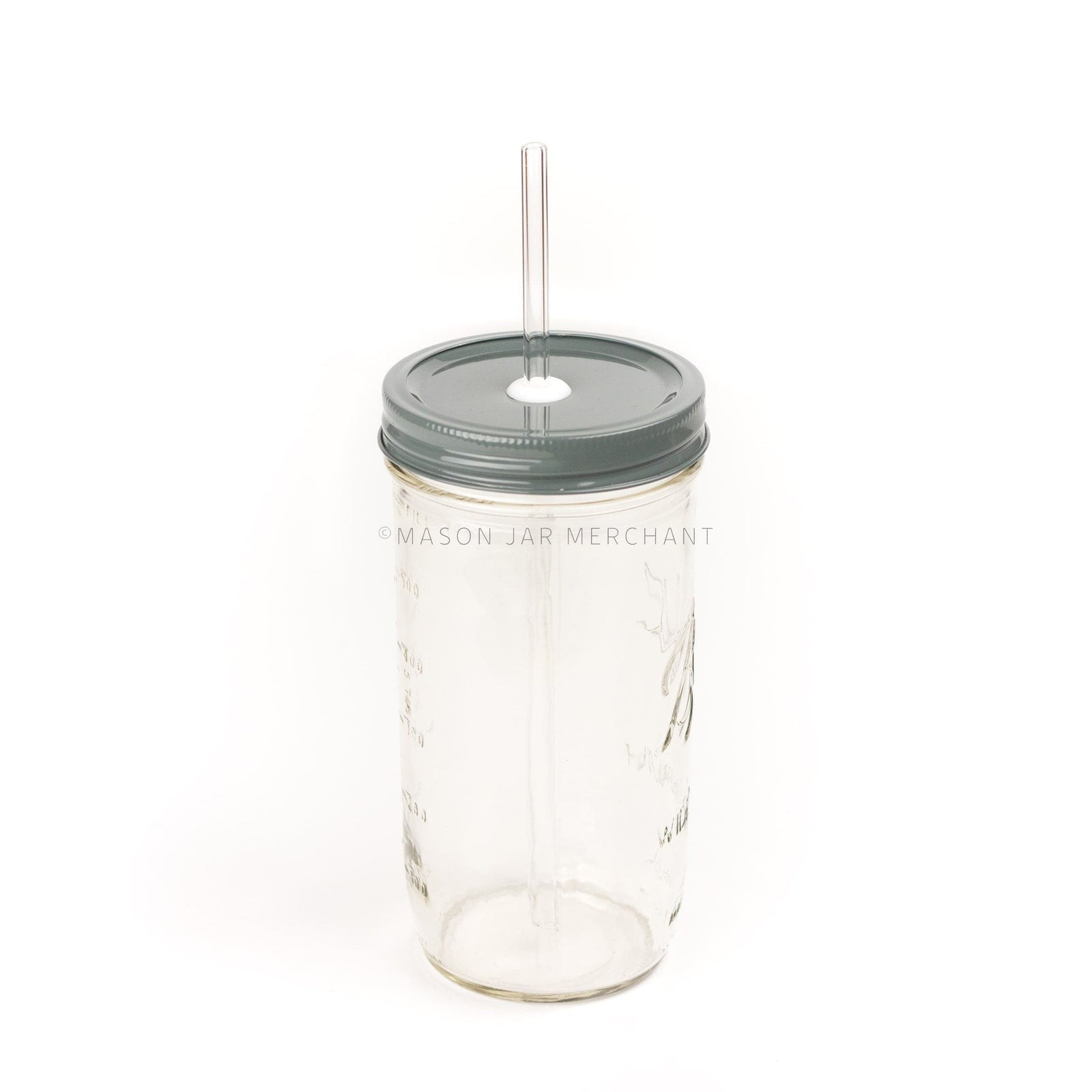 Close-up of a 24 oz wide mouth mason jar with a dark gray custom painted lid with a white silicone grommet and a glass straw, against a white background