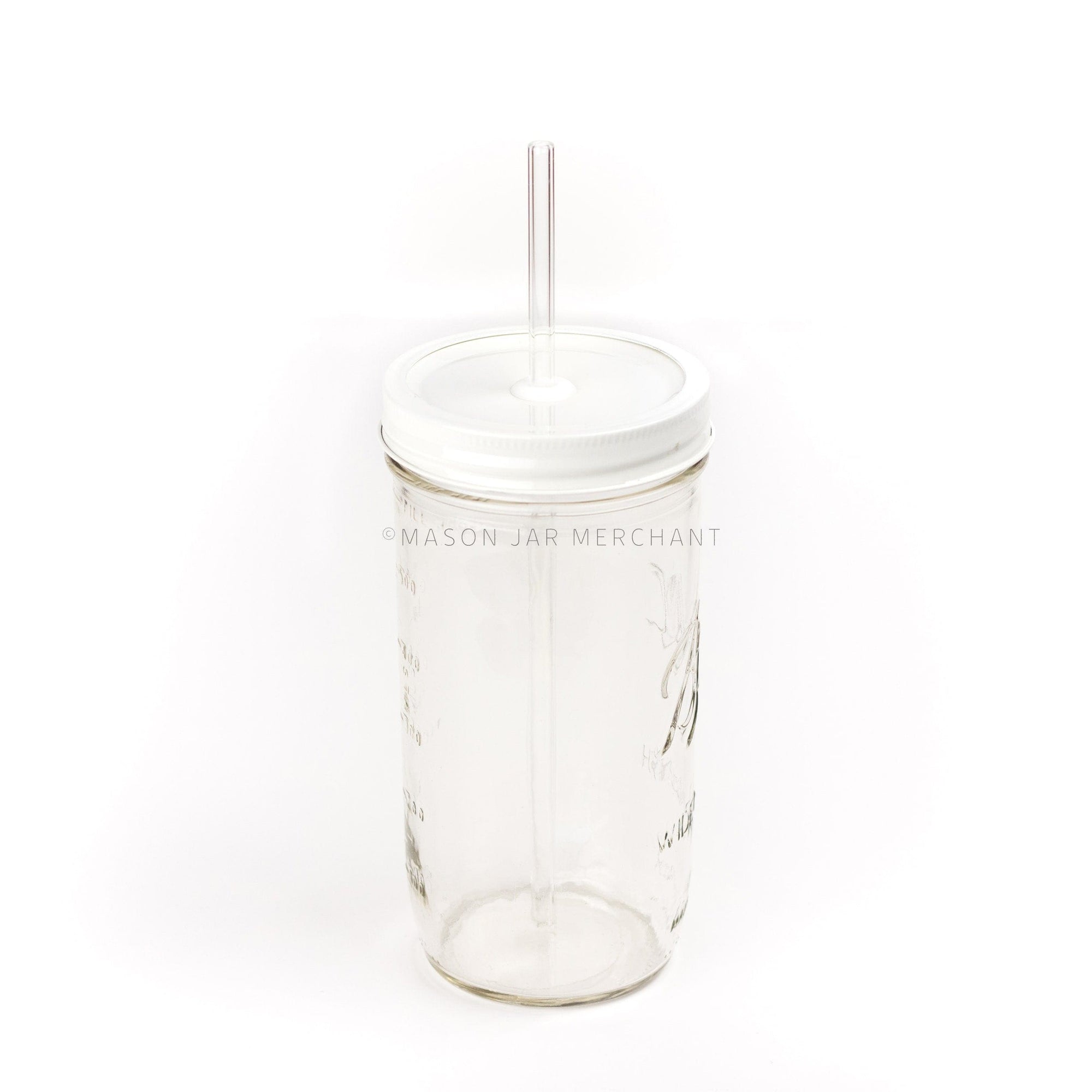 a close up of a white custom painted straw lid on a 24 oz glass mason jar with a glass reusable straw
