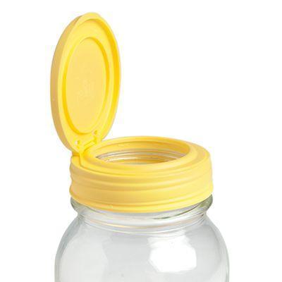 Yellow reCAP 'FLIP' Cap or a Mason Jar Flip Top Lid on a white background.