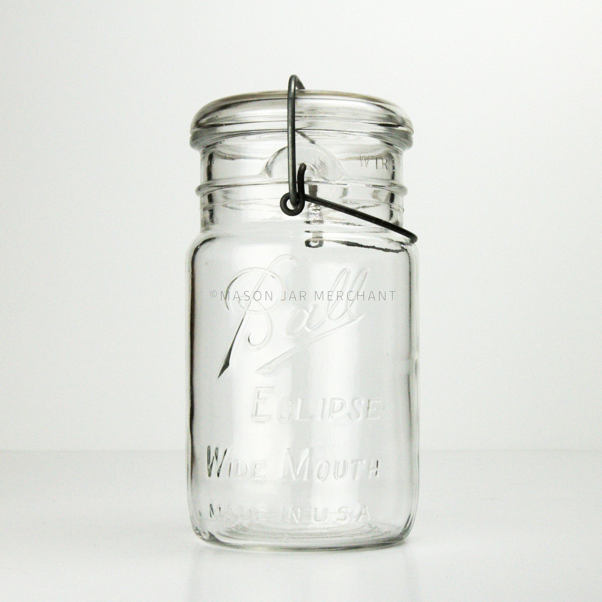Vintage wire bail and glass lid quart mason jar with Ball Eclipse logo