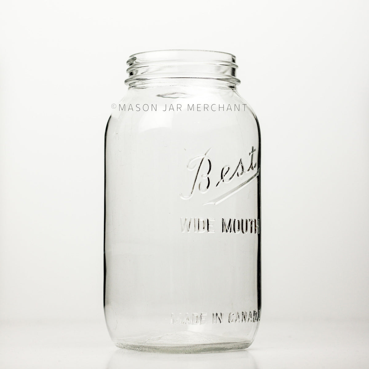 A side view of a Wide mouth half-gallon mason jar with Best Wide Mouth logo , against a white background