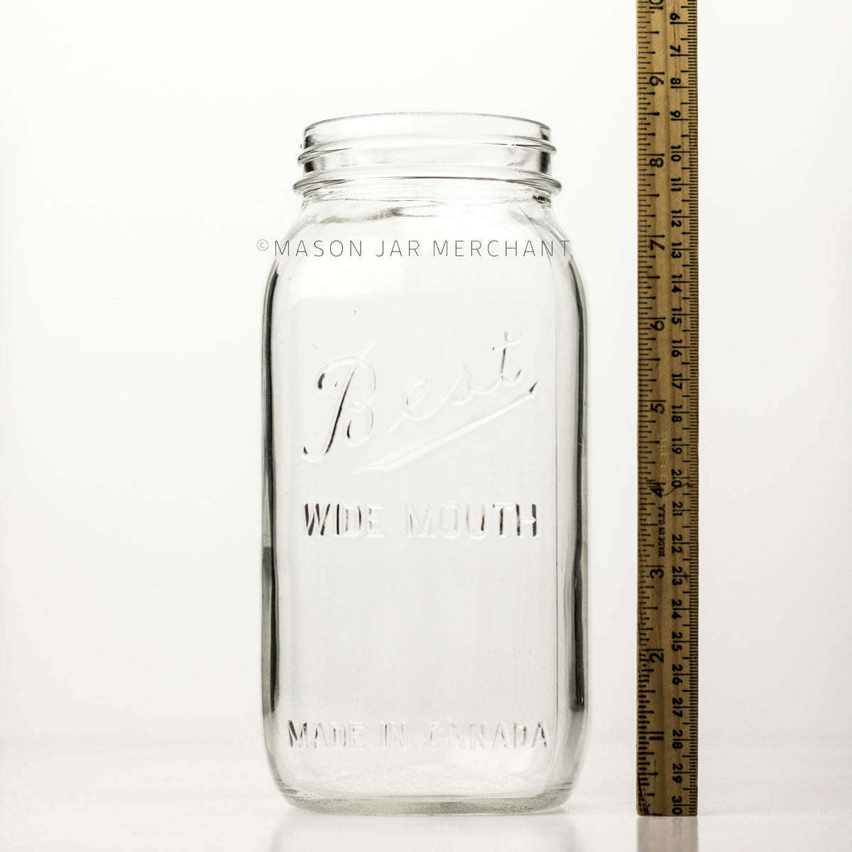 A Wide mouth half-gallon mason jar with Best Wide Mouth logo and a meter stick beside it and is shown against a white background