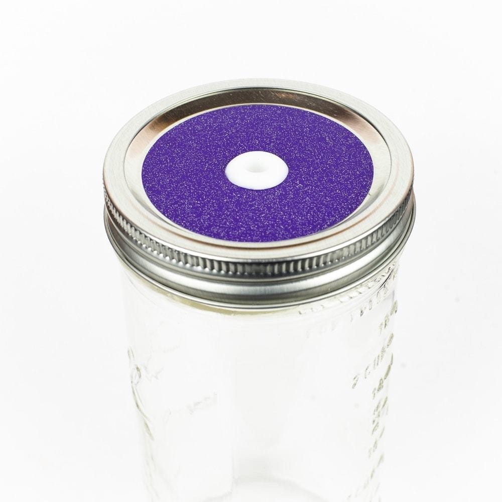 Medium purple Glitter Mason Jar Straw Lid on a silver lid against a white background.