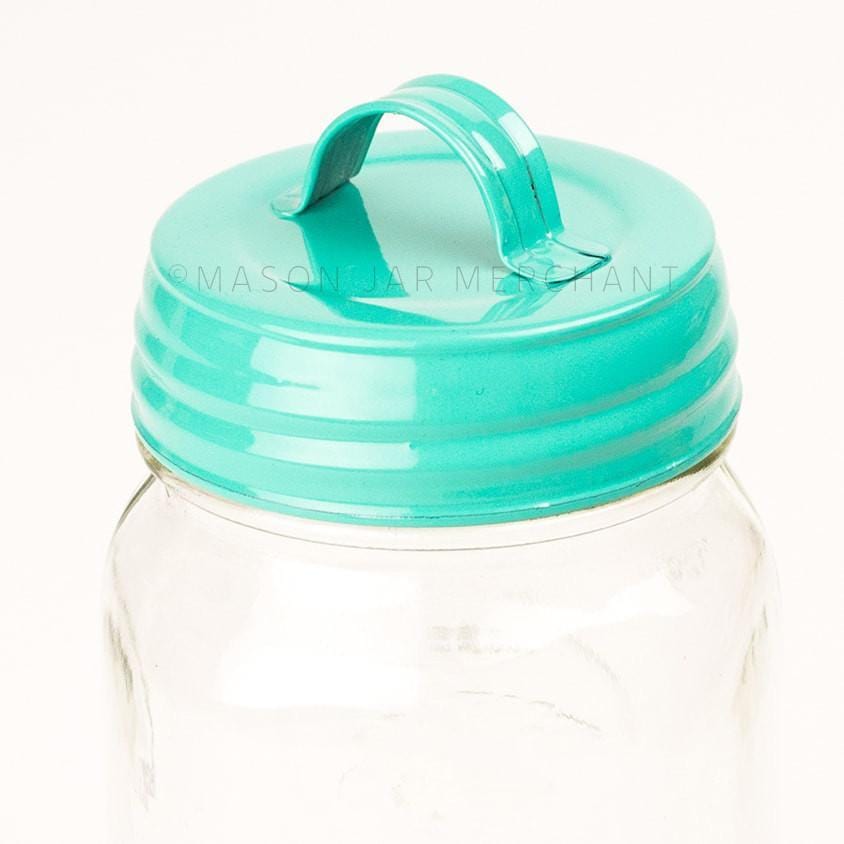 Aqua blue vintage look enamel mason jar lid shown on a white background.
