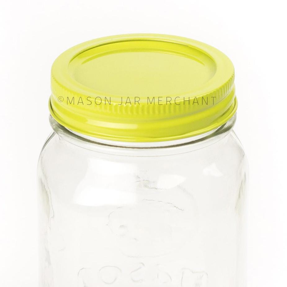 A close up of a lime green painted lid on a regular mouth jar