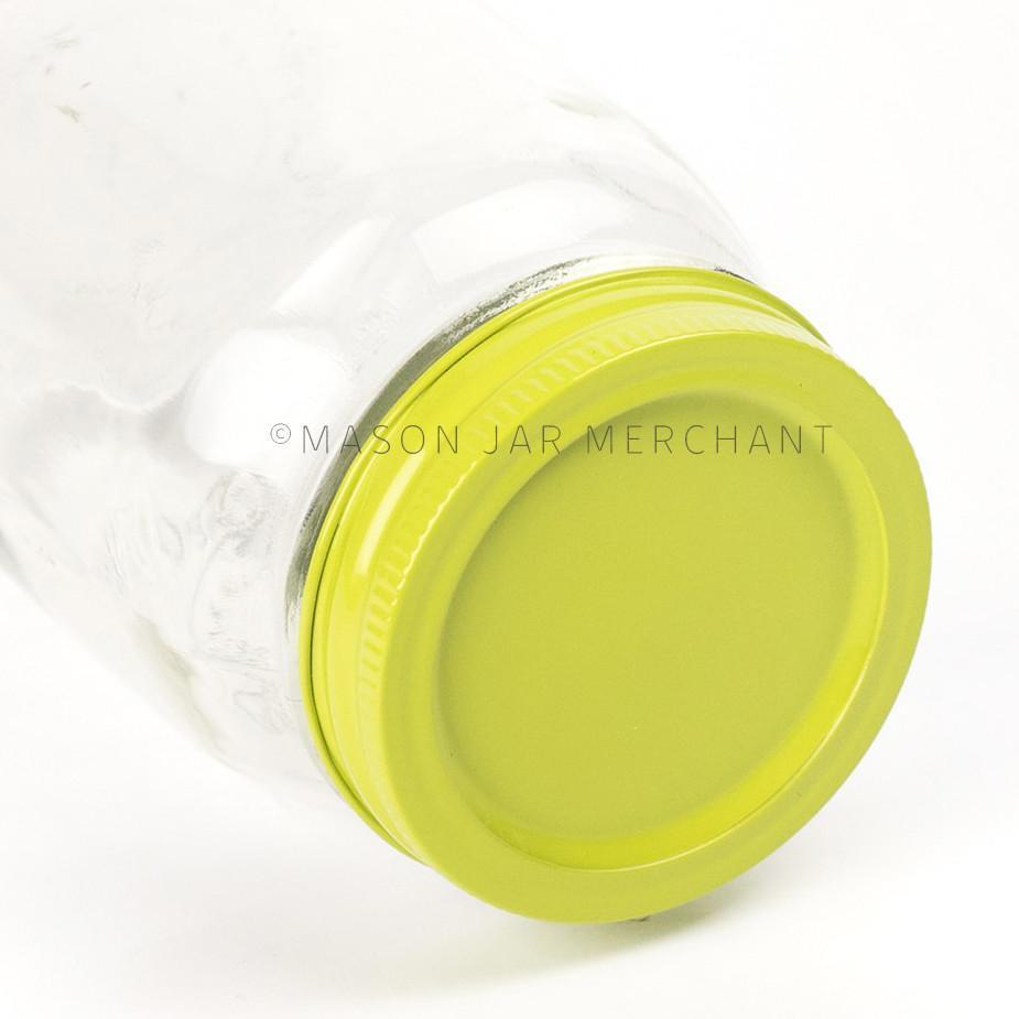 A close up of a lime green painted lid on a regular mouth jar