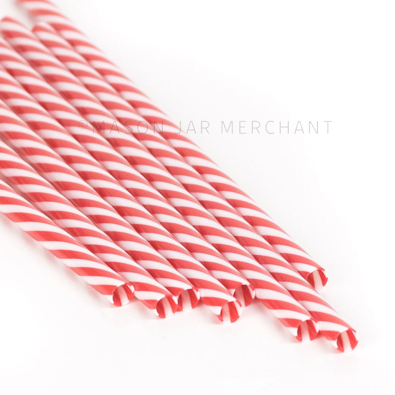Red and white striped BPA-free reusable plastic straws against a white background