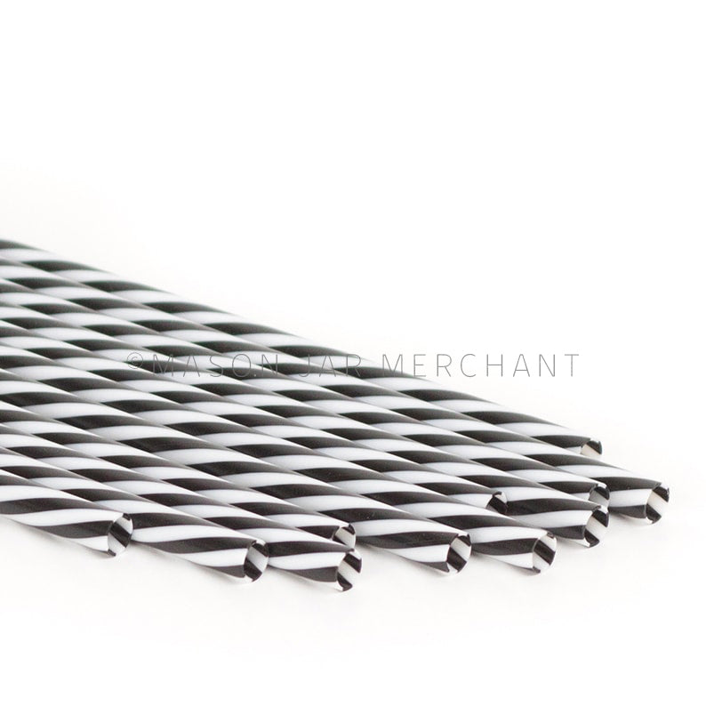 Black and white striped BPA-free reusable plastic straws against a white background