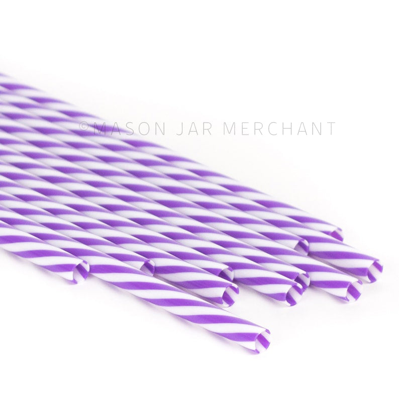 Purple and white striped BPA-free reusable plastic straws against a white background