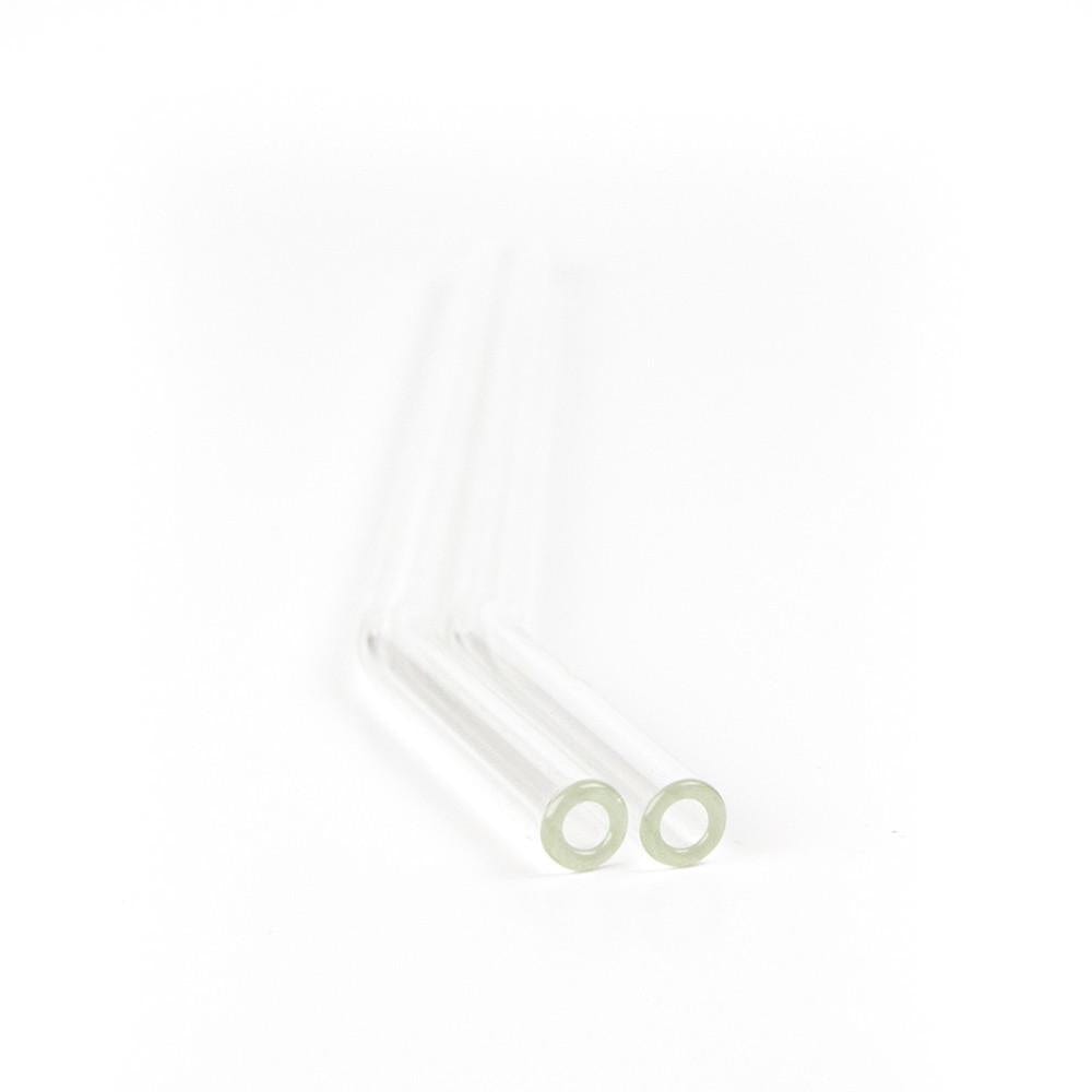 close up of two bent reusable glass straws on a white background