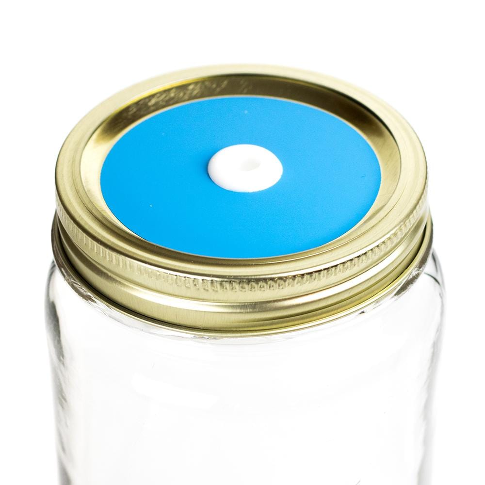 Photo of a mason jar with a straw lid with a colored decal. Photographed against a white background.