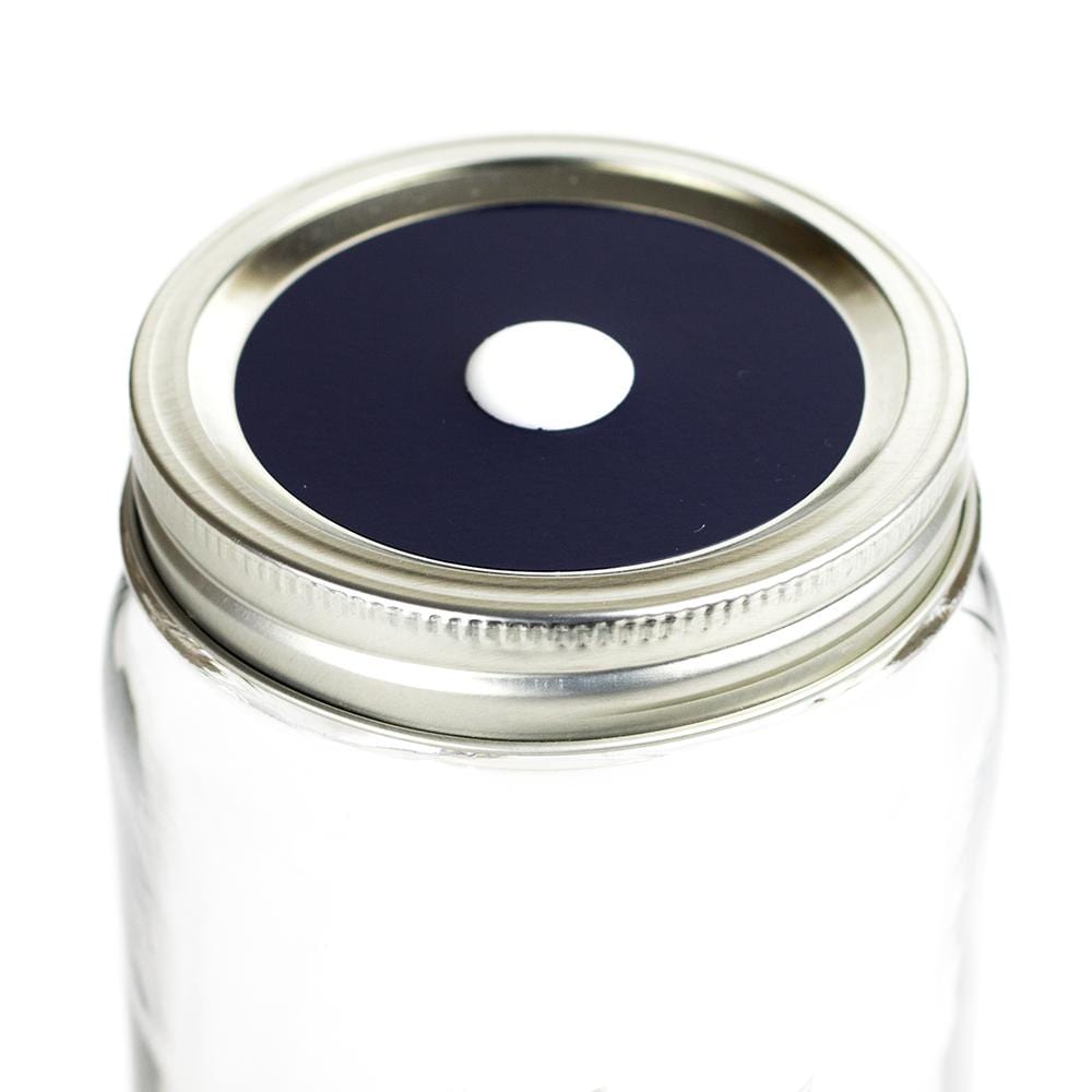 Photo of a mason jar with a straw lid with a colored decal. Photographed against a white background.