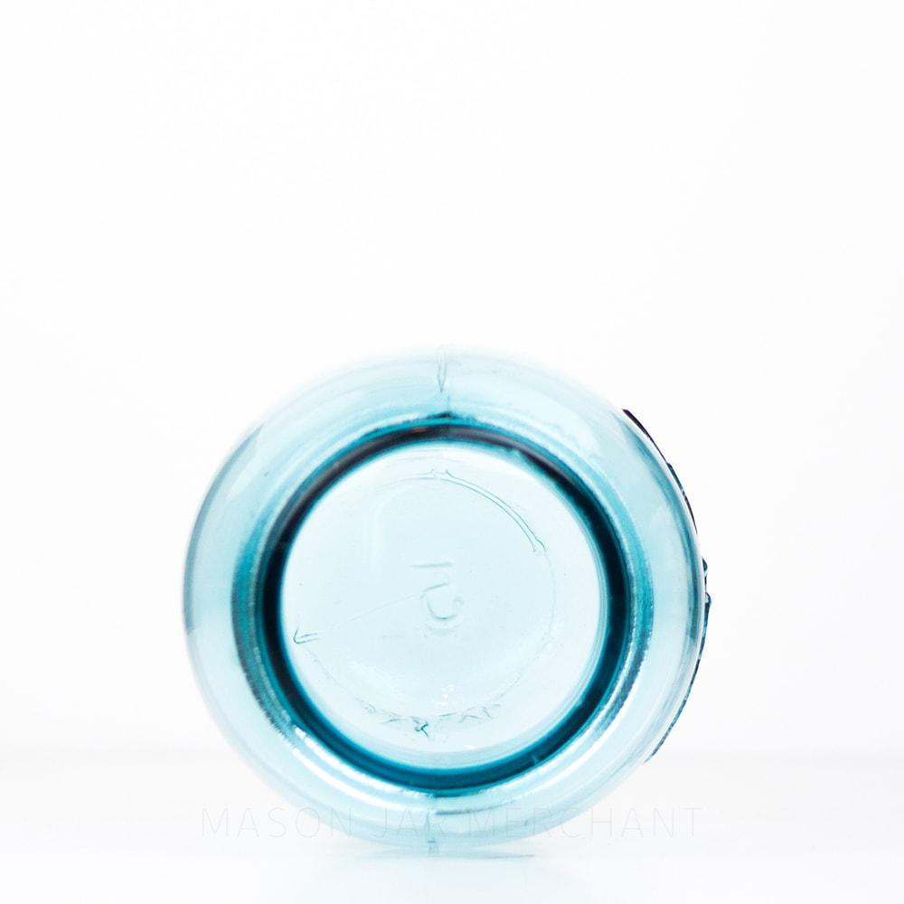 A Vintage blue Ball regular mouth quart mason jar against a white background