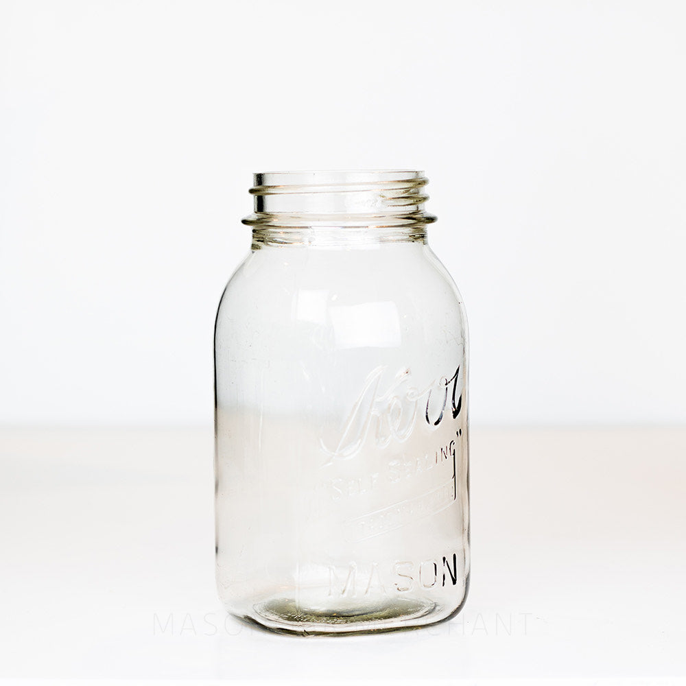side view of a Vintage Kerr Regular Mouth Quart Jar on White Background. Reads Kerr &quot;Self Sealing&quot; [TRADE MARK REC].