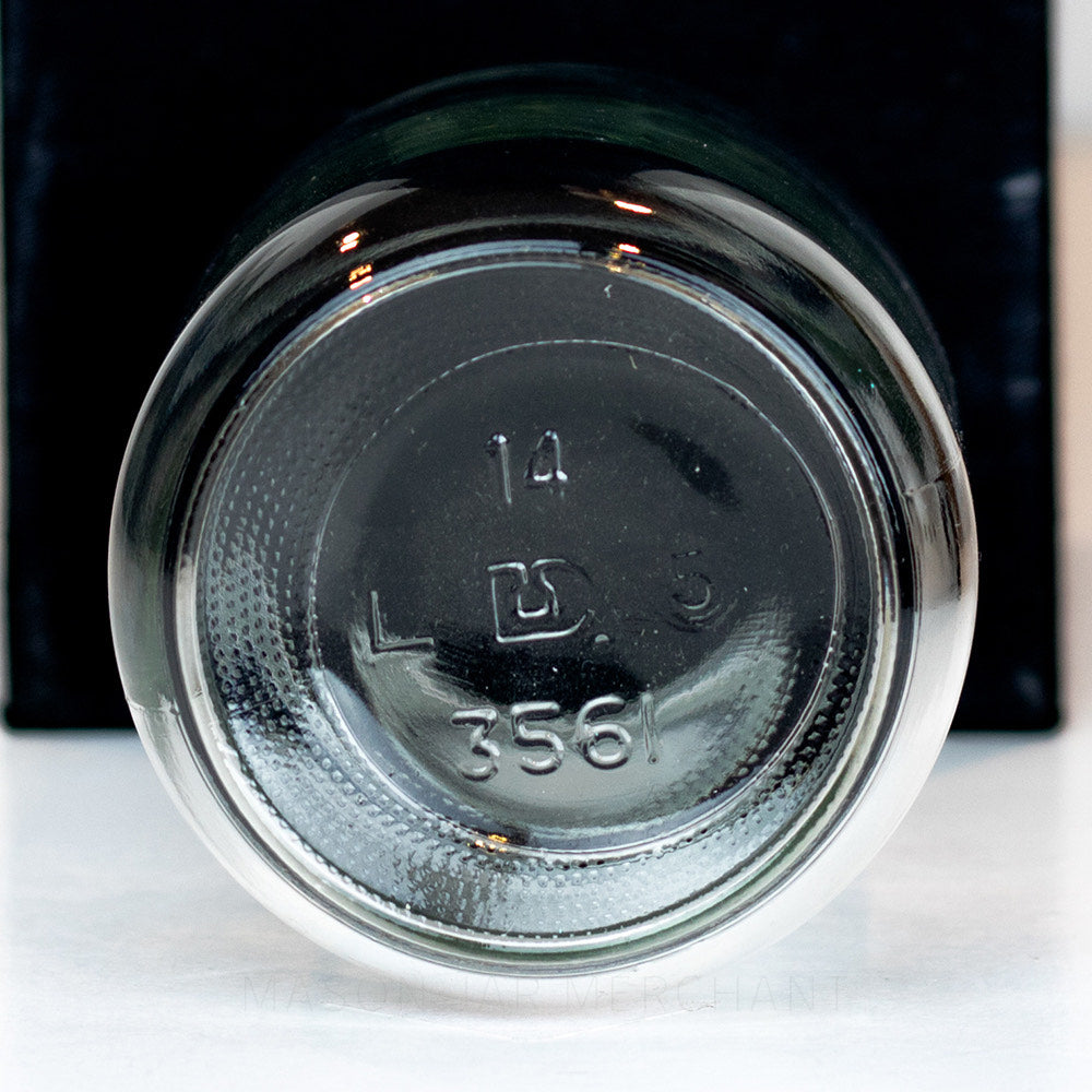 Regular mouth pint mason jar with no logo and plain sides on a white background 