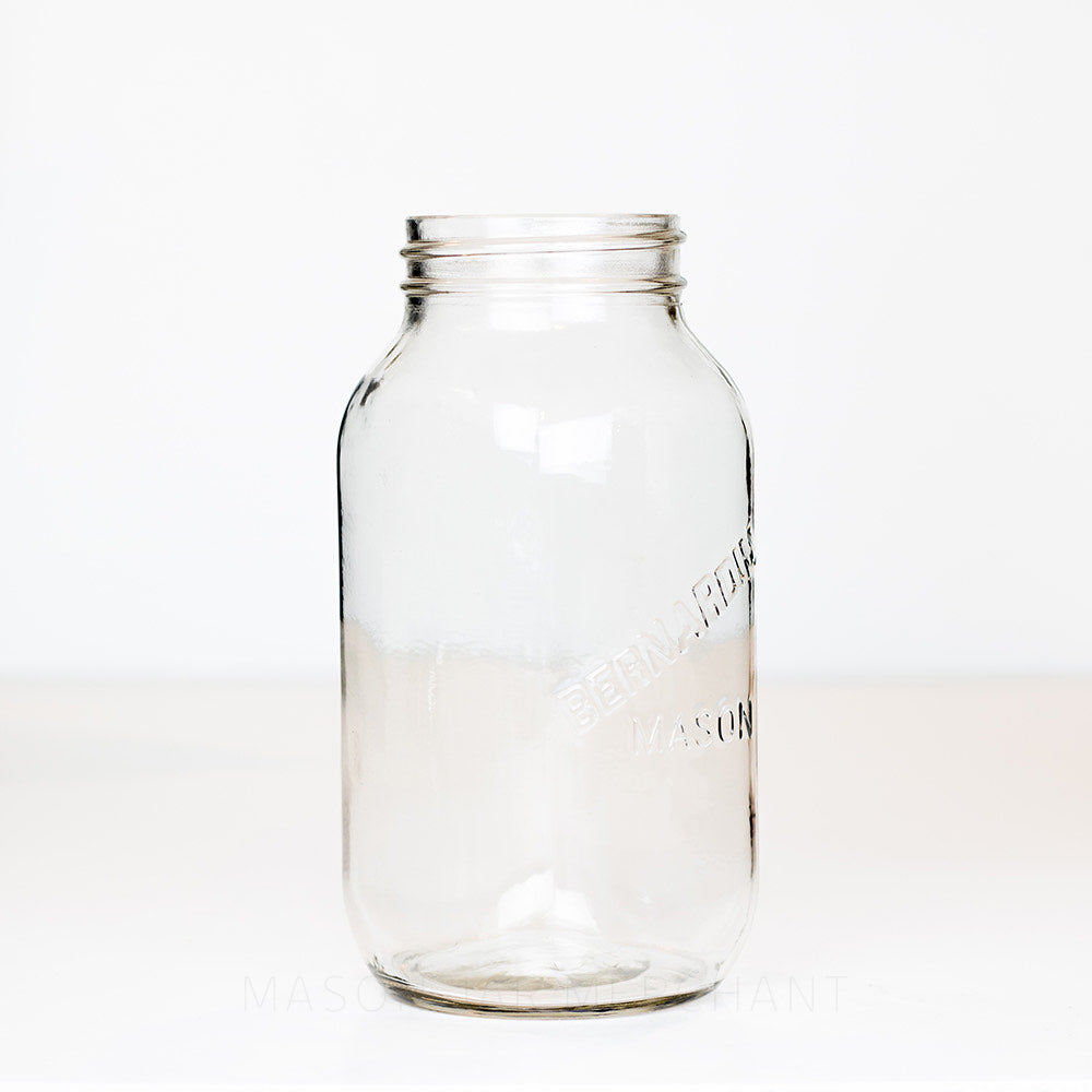 Side view of a Bernardin regular mouth mason jar against a white background