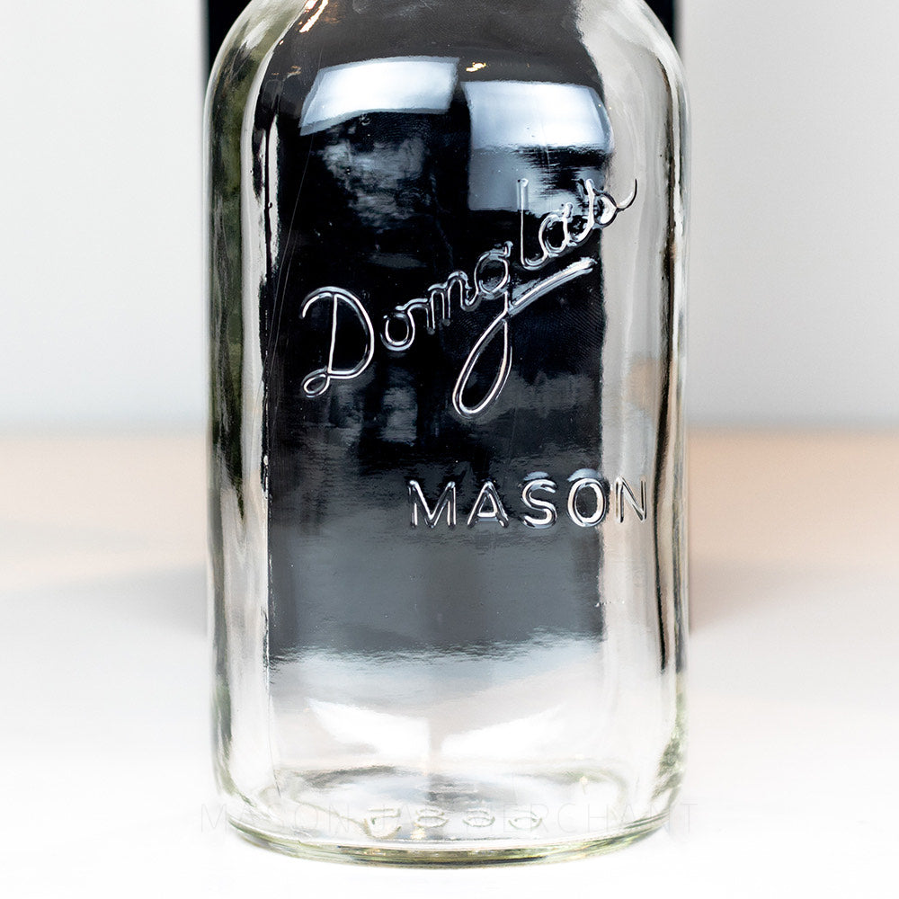 Close-up of a Domglas regular mouth quart mason jar logo