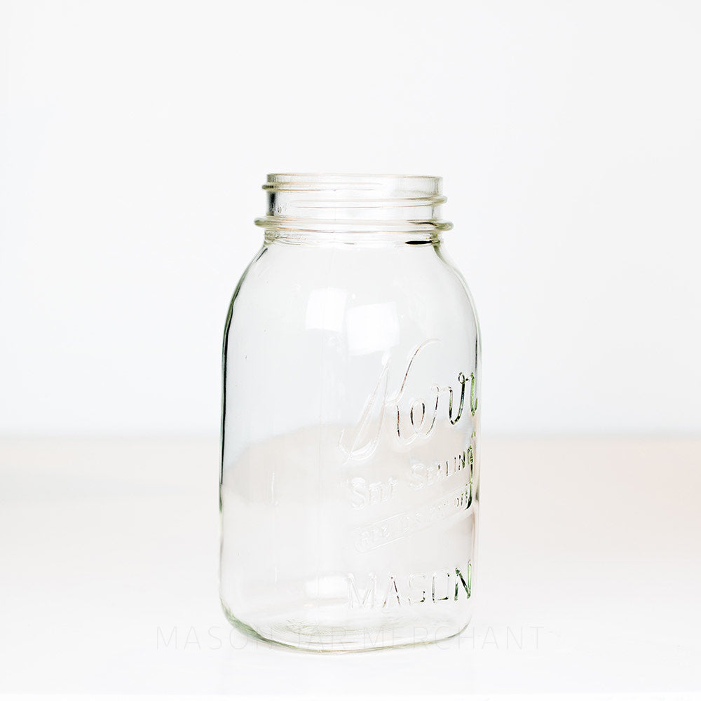 side view of a Vintage Kerr Regular Mouth Quart Jar on White Background. Reads Kerr &quot;Self Sealing&quot; [REG. U.S. PAT. OFF.].