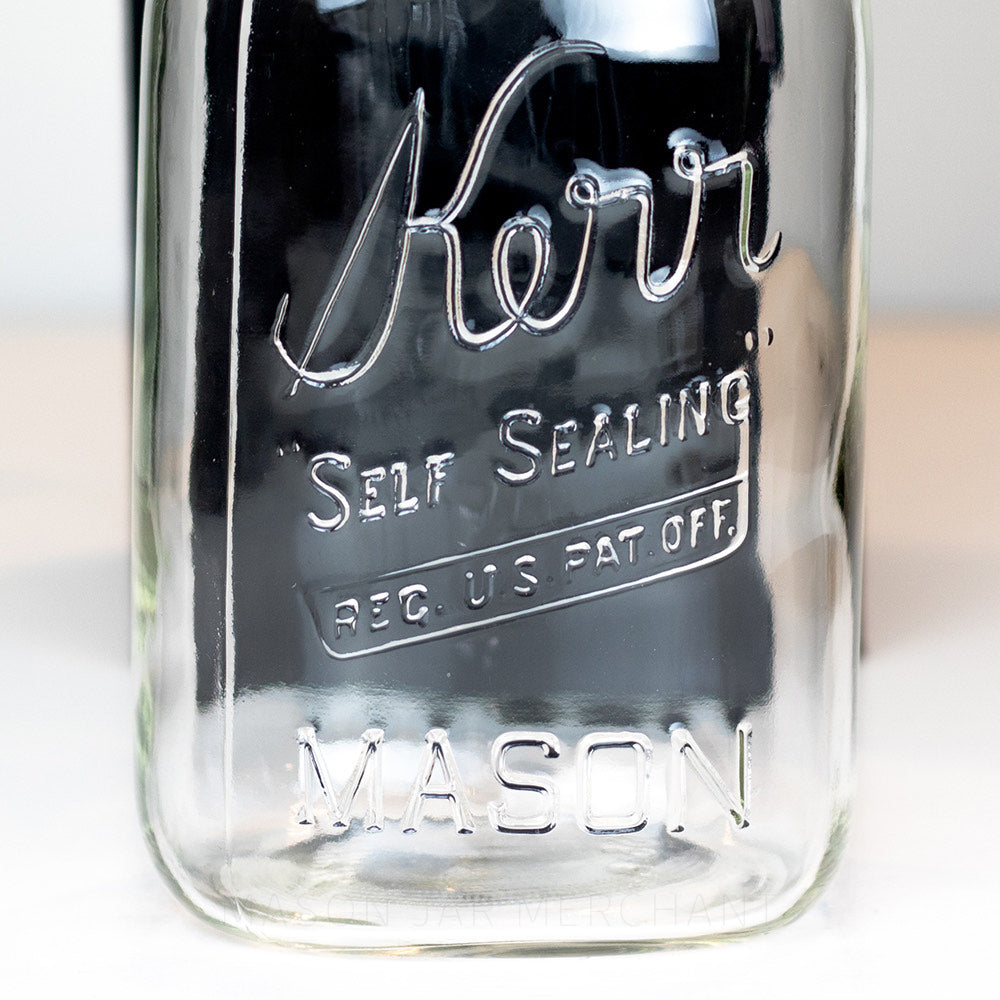 close up of a Vintage Kerr Regular Mouth Quart Jar on White Background. Reads Kerr &quot;Self Sealing&quot; [REG. U.S. PAT. OFF.].