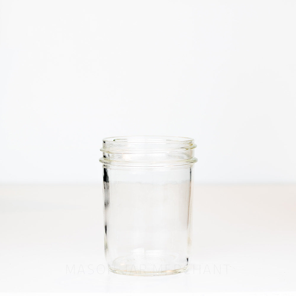 Smooth-sided Dominion wide mouth pint mason jar against a white background 