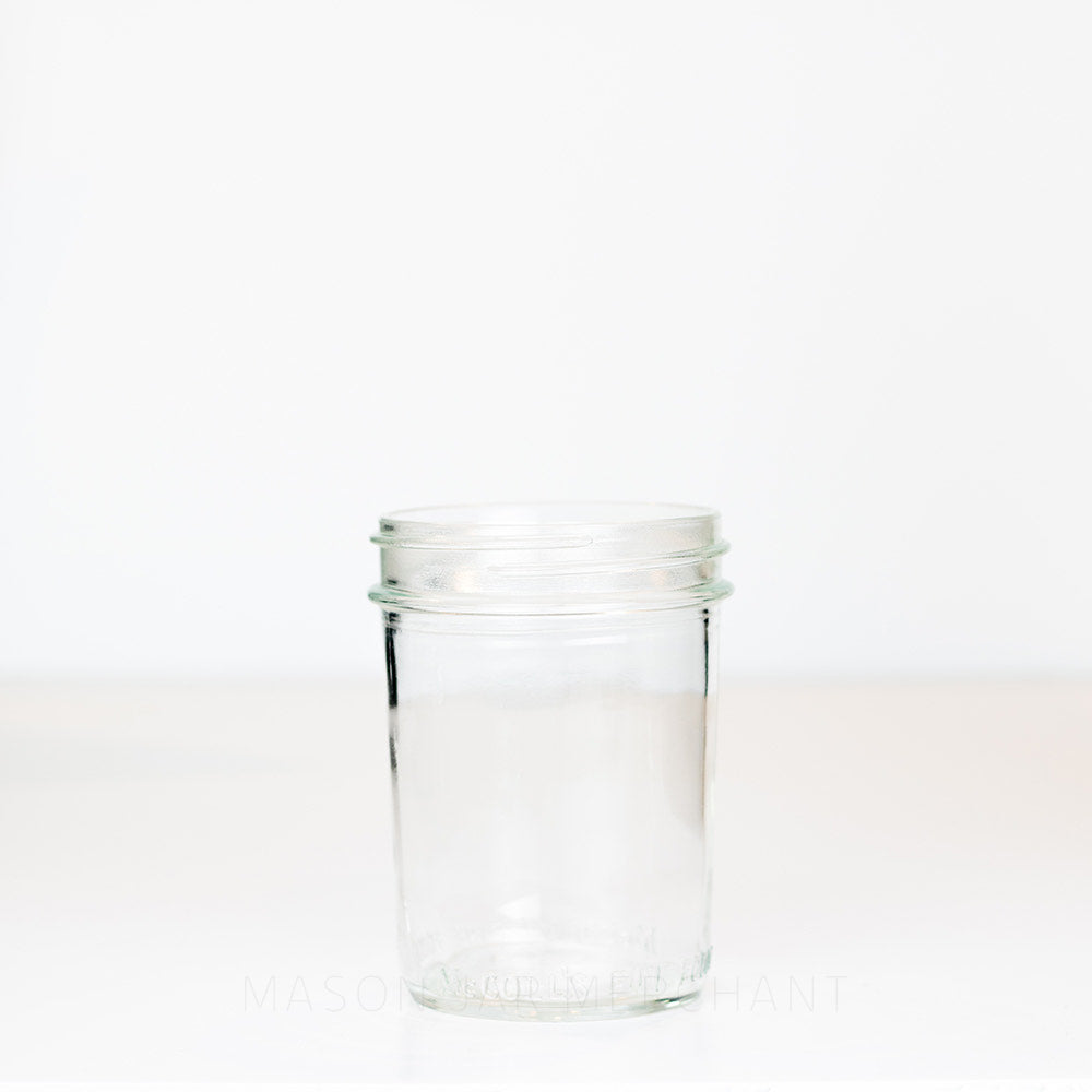 Wide mouth pint mason jar against a white background 