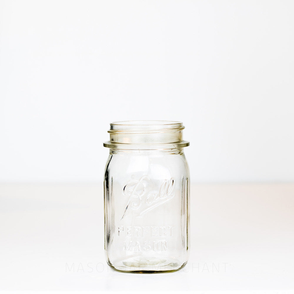 Regular mouth pint mason jar with Ball Perfect Mason logo, against a white background 