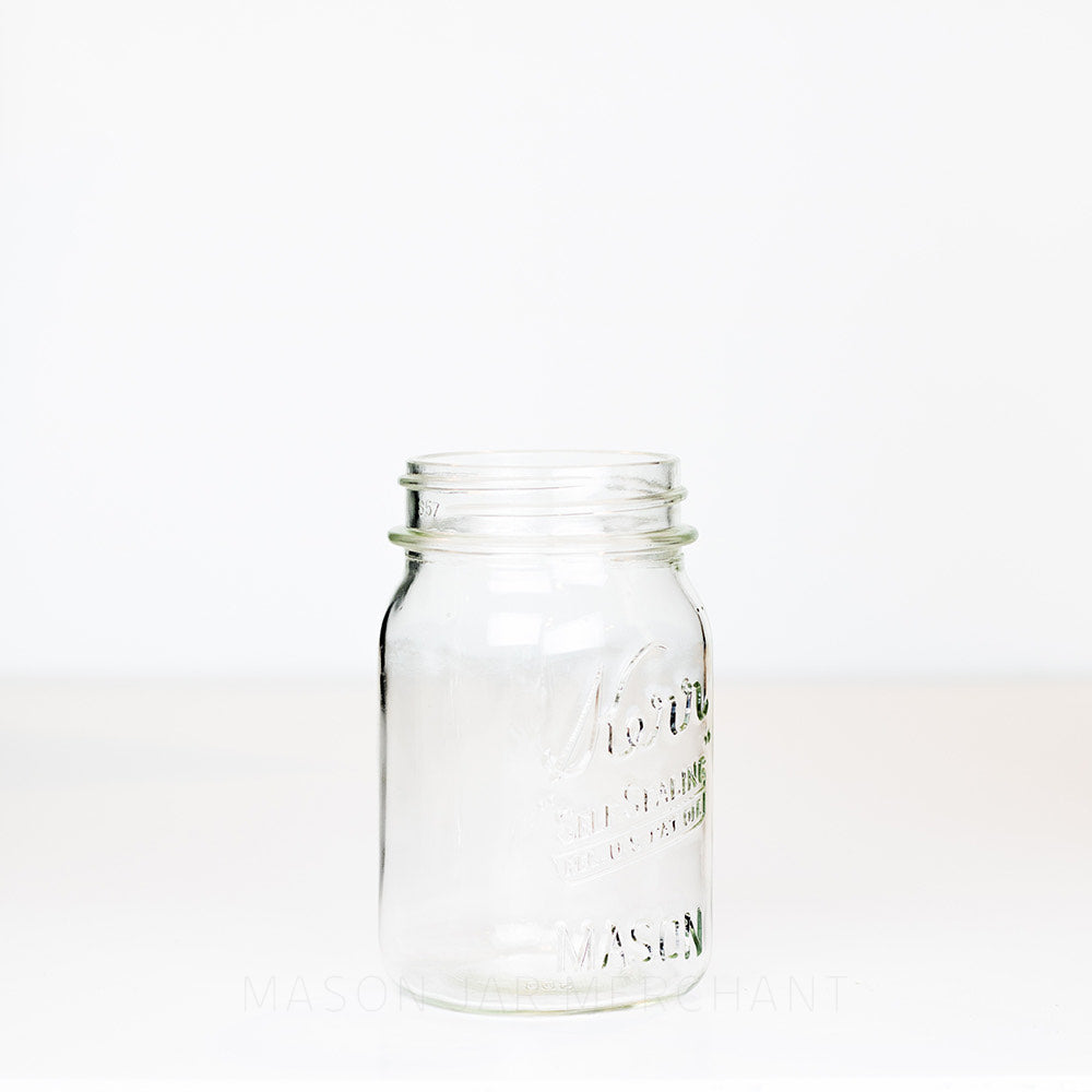 Wide mouth pint mason jar with Kerr self-sealing logo against a white background