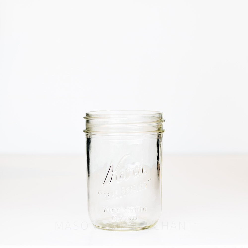Kerr "self sealing" glass mason jar on a white background