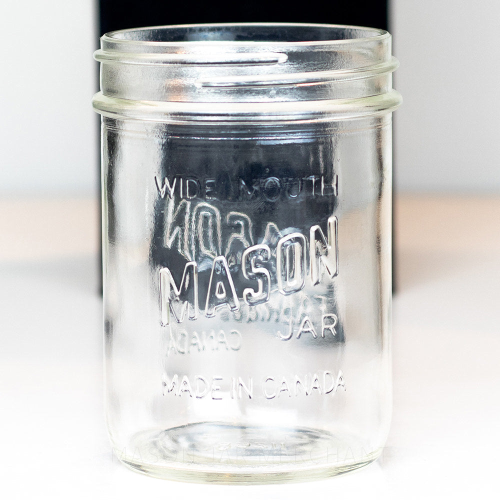 close up of a Canadian mason wide mouth pint jar against a white background