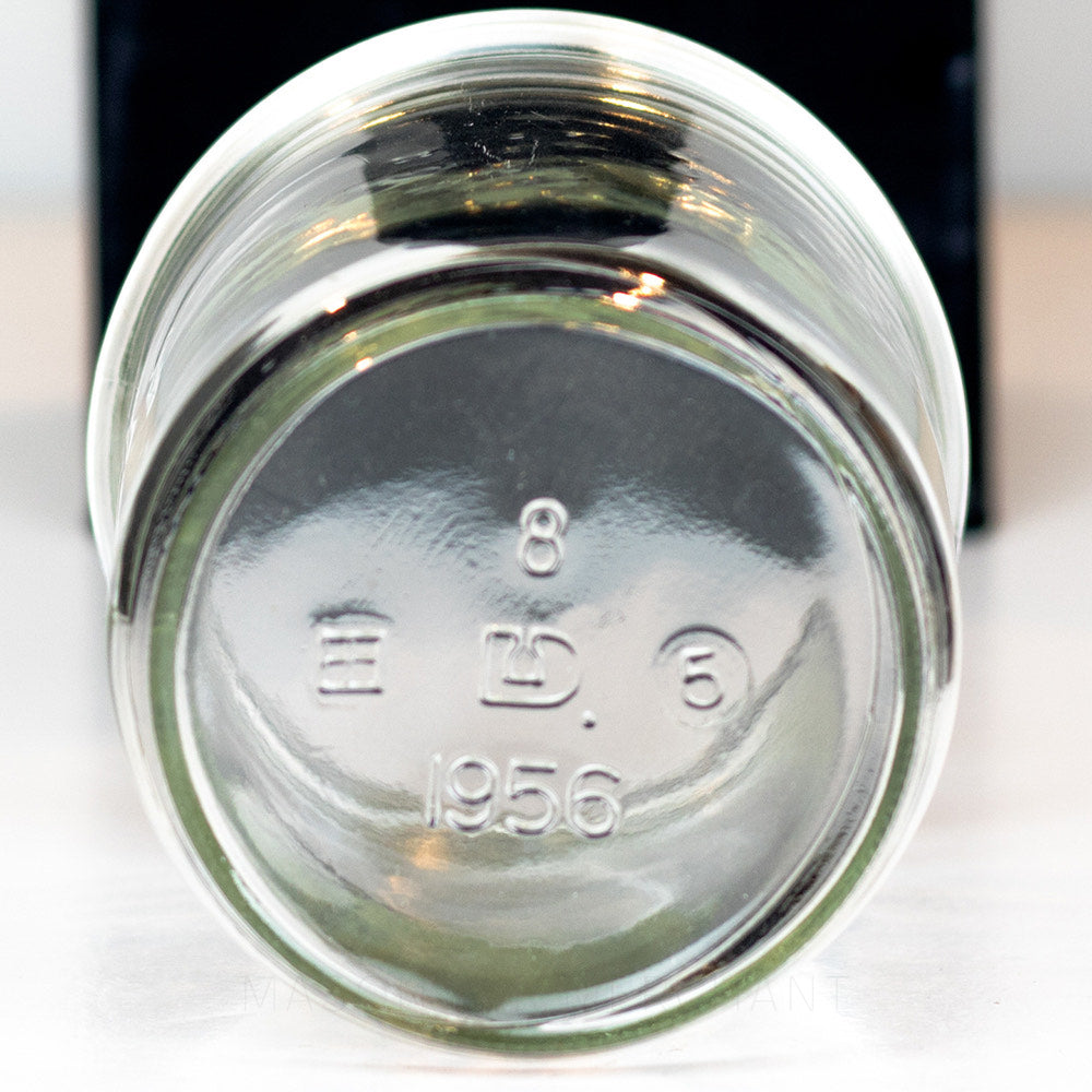 Plain Dominion wide mouth pint mason jar against a white background 