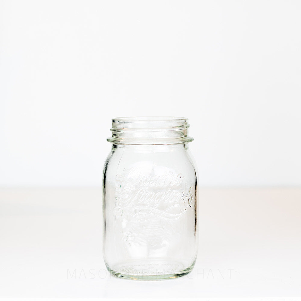 Regular mouth pint mason jar with Quattro Stagioni logo, on a white background 