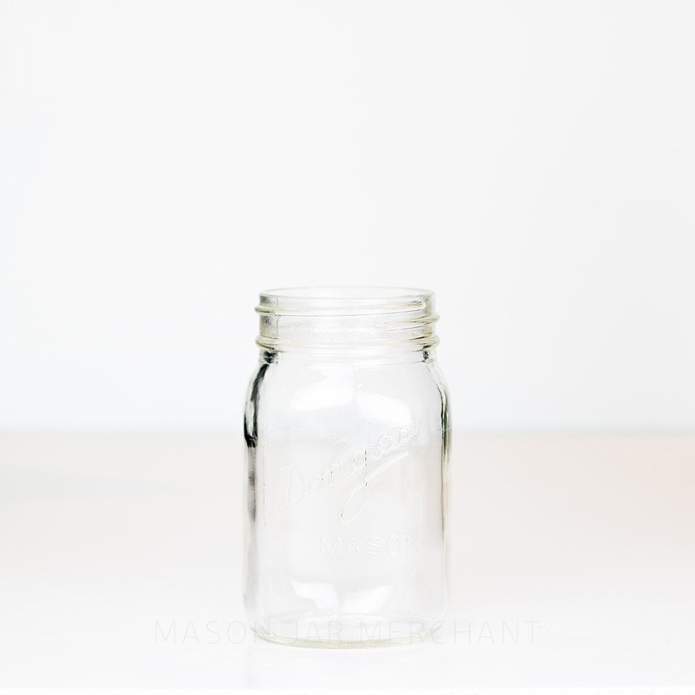 Regular mouth pint mason jar with Domglas logo on a white background