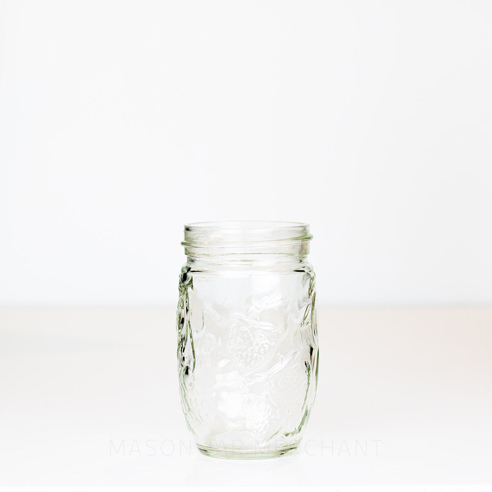 10 oz regular mouth mason jar with a unique tall and thin bulb shape, on a white background