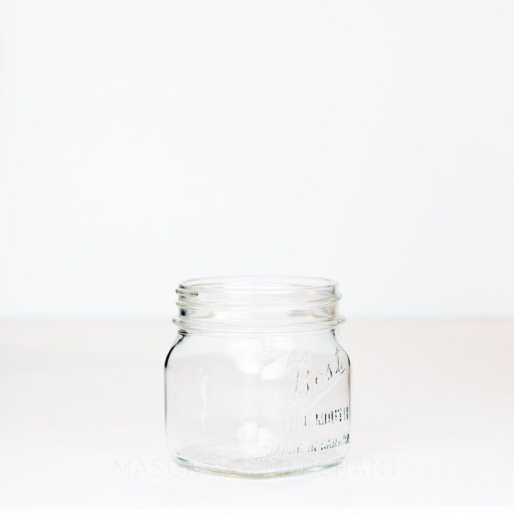 A side view of a Wide mouth pint mason jar with Best wide mouth logo, against a white background