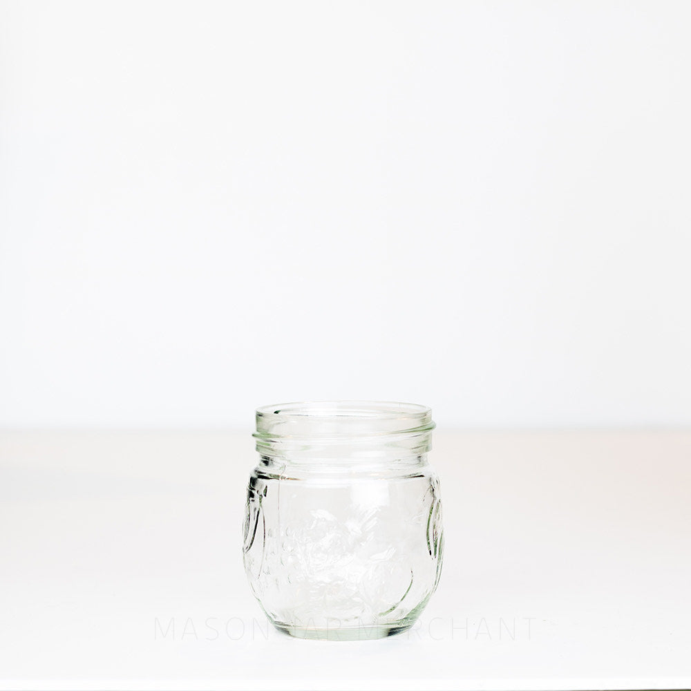 6.5 oz regular mouth mason jar with a unique bulb shape and a fruit pattern on a white background