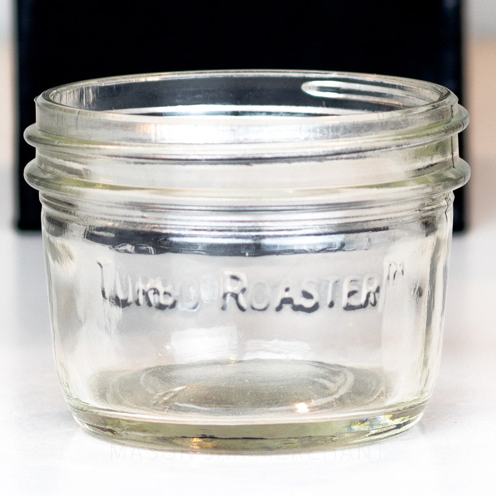 A close up of a plain 8 oz glass reusable mason jar with the words &quot;Turbo Roaster&quot; on the side