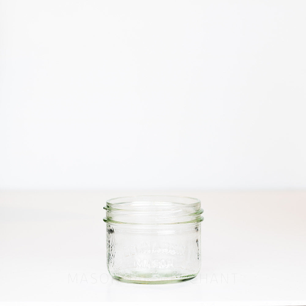Wide mouth half pint mason jar with Bernardin Mason logo against a white background 
